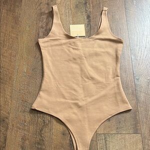 Tan Bodysuit with High-Leg Cut and Scoop Neckline
